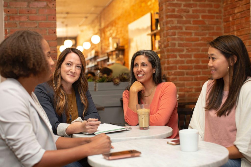 Women having a casual conversation at café